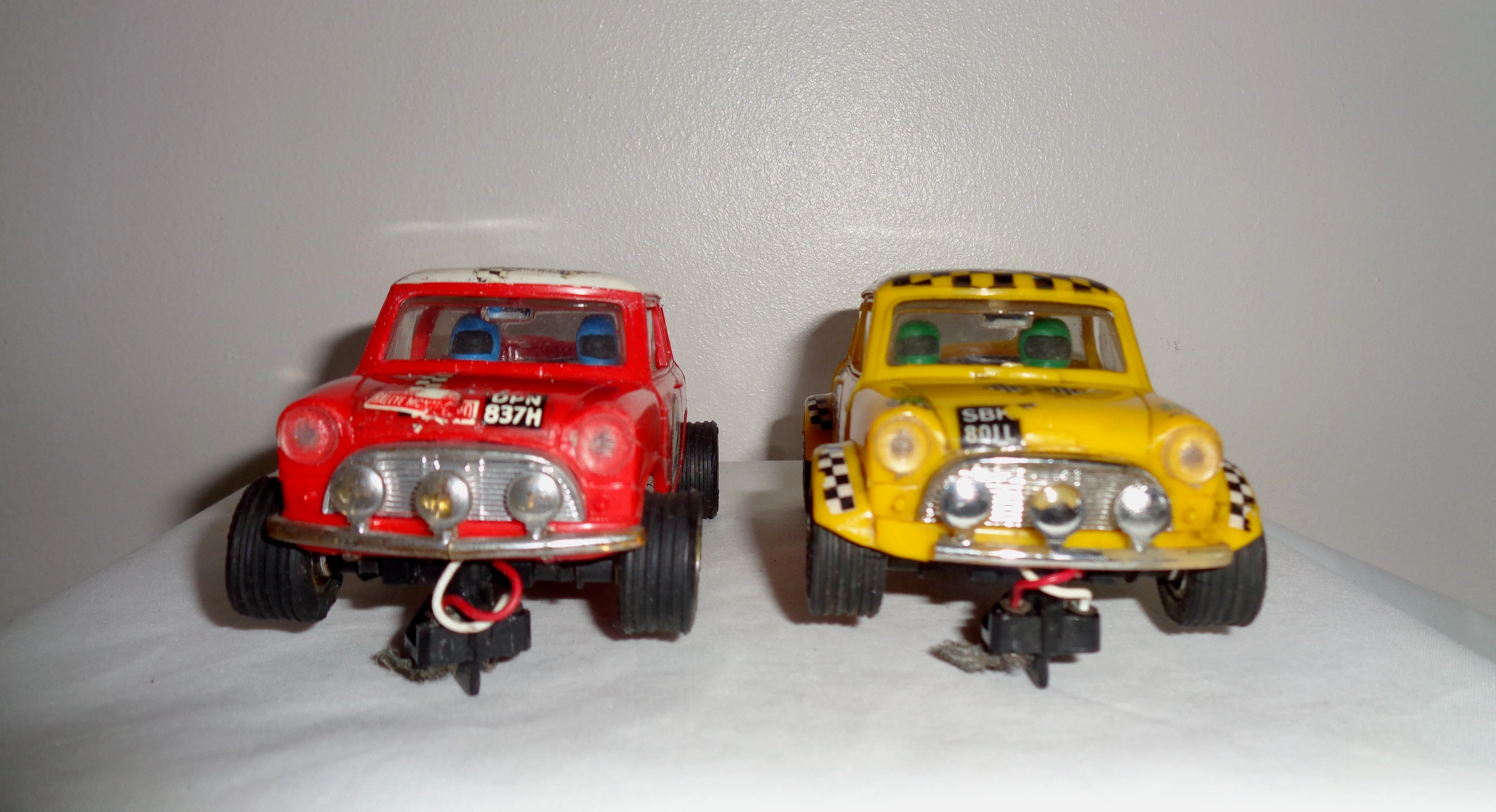 Pair of Scalextric C7 Rally Mini Coopers: Red With White Roof and Yellow With Black Chequered Roof