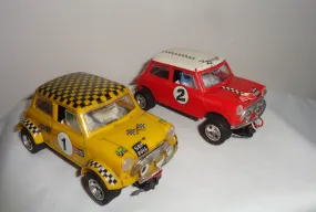 Pair of Scalextric C7 Rally Mini Coopers: Red With White Roof and Yellow With Black Chequered Roof