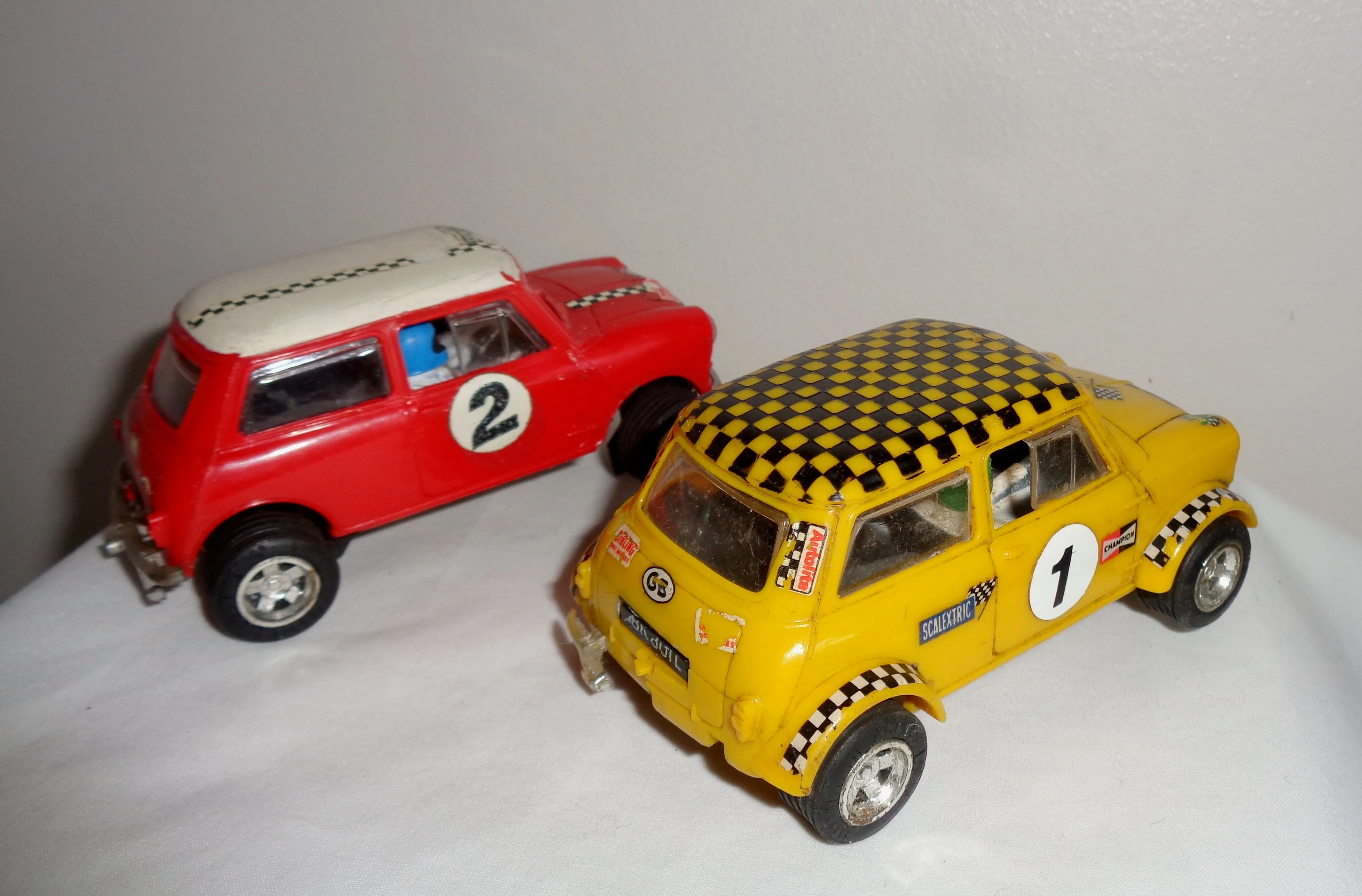 Pair of Scalextric C7 Rally Mini Coopers: Red With White Roof and Yellow With Black Chequered Roof