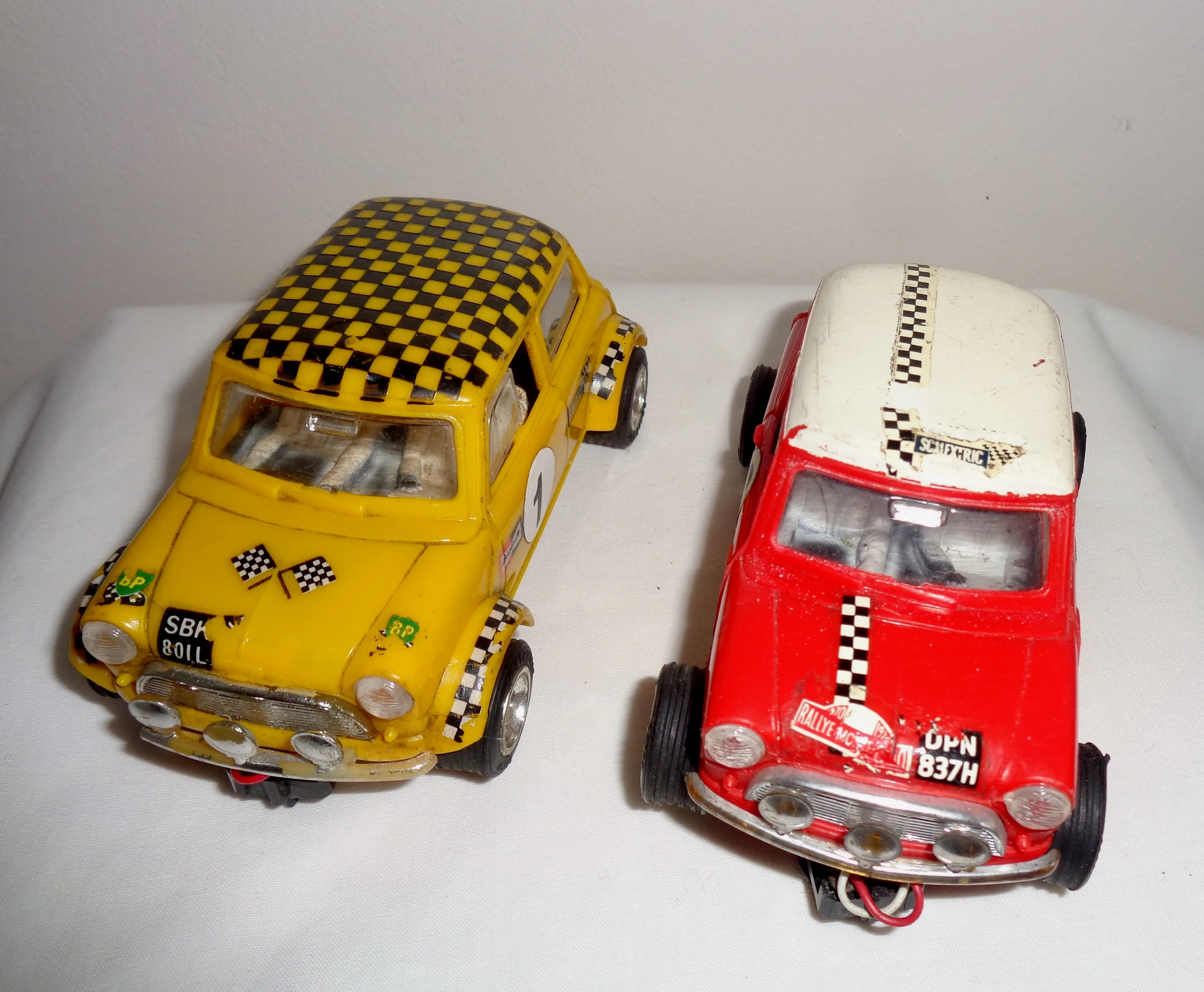 Pair of Scalextric C7 Rally Mini Coopers: Red With White Roof and Yellow With Black Chequered Roof