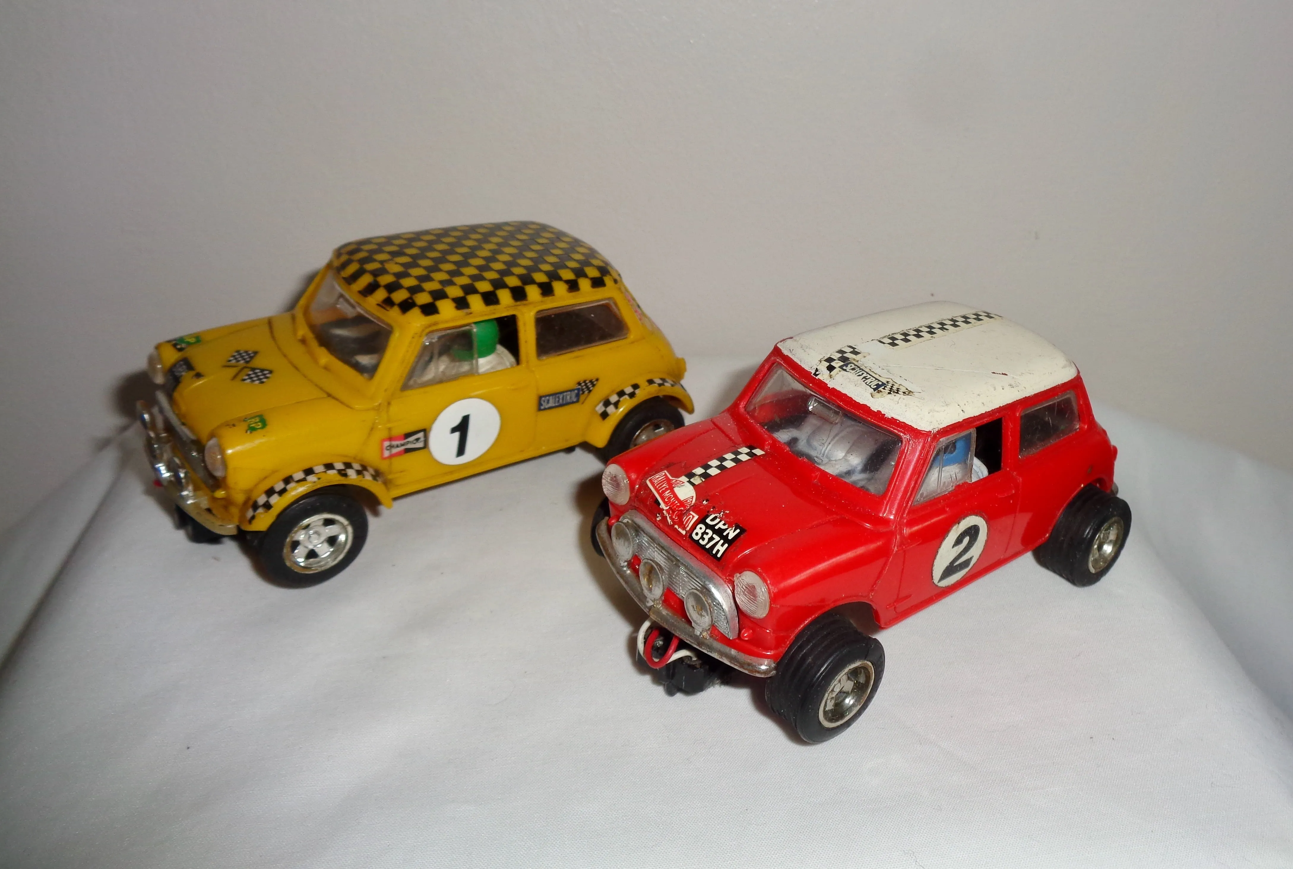 Pair of Scalextric C7 Rally Mini Coopers: Red With White Roof and Yellow With Black Chequered Roof