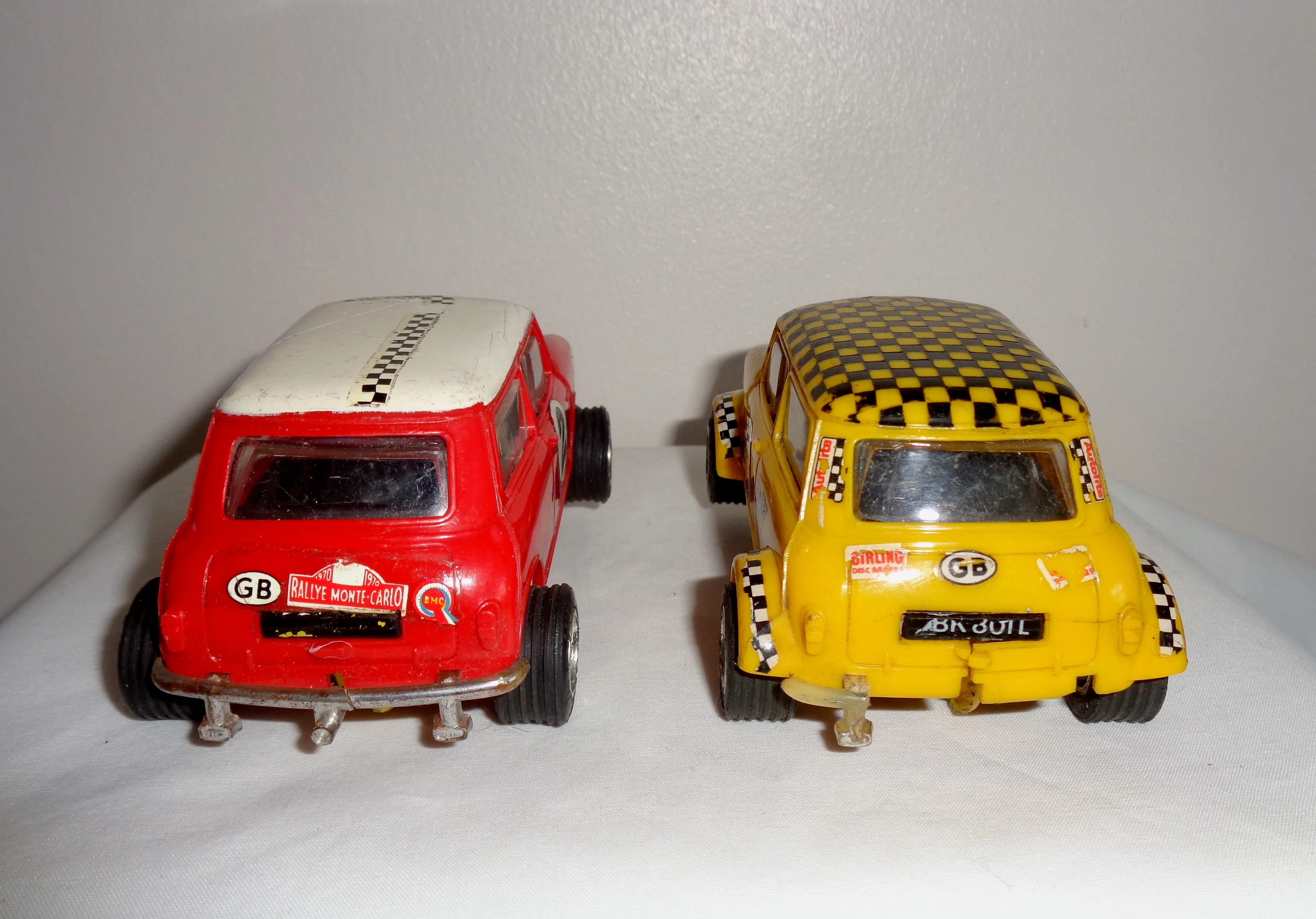 Pair of Scalextric C7 Rally Mini Coopers: Red With White Roof and Yellow With Black Chequered Roof